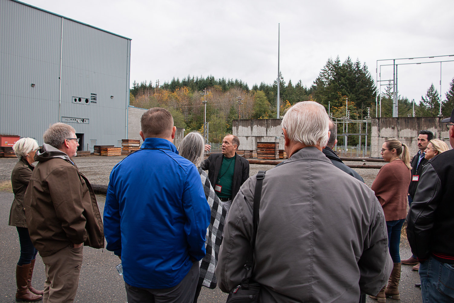 Zap Energy Vice President of Product Ryan Umstattd walks attendees through the Big Hanaford site on Tuesday morning following a presentation he gave explaining his company's fusion technology.