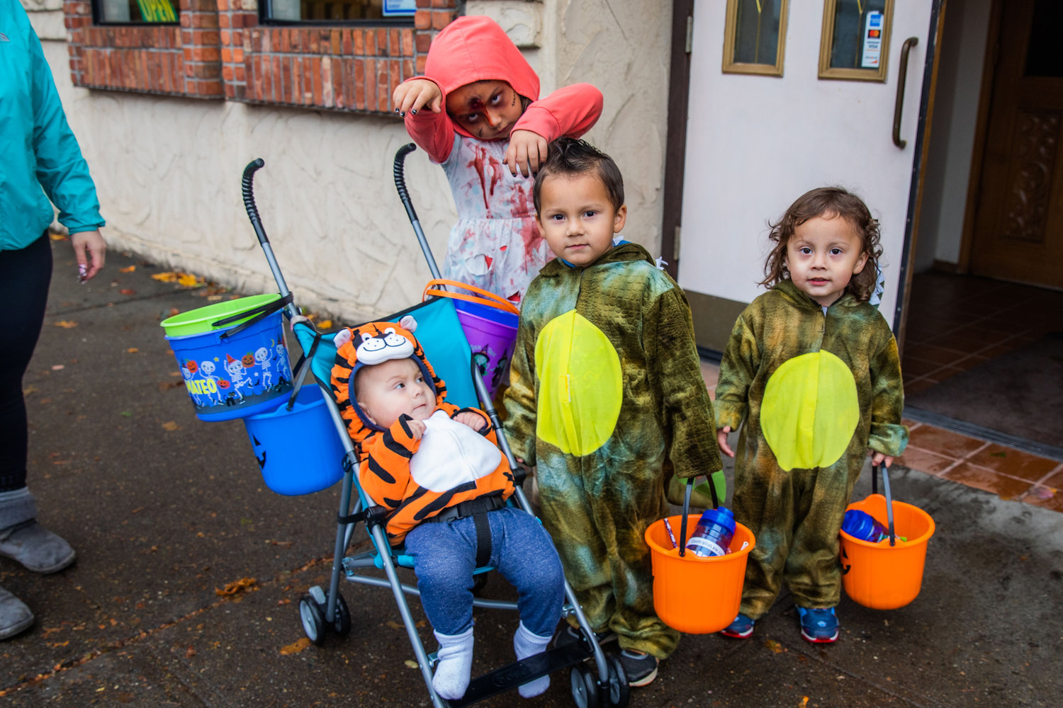 Castaneda kids pose for a photo in costume in downtown Centralia on Monday for Halloween.
