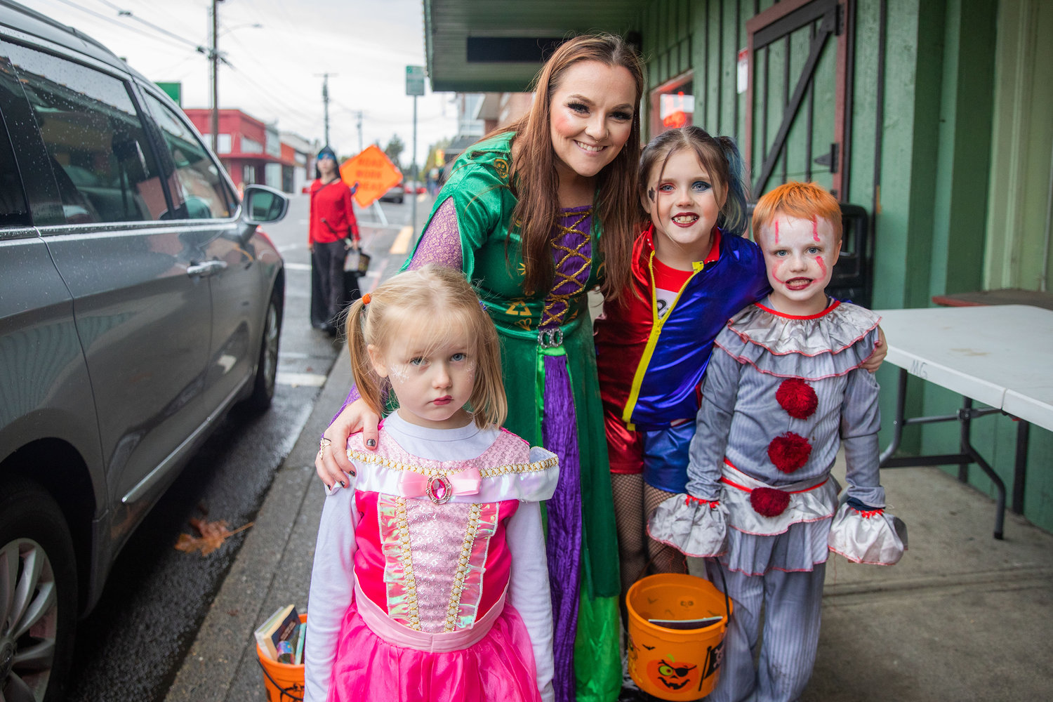 Spencer Hoven, center left, poses for a photo with Lynnley, Garrett and Kaidyn while trick-or-treating in downtown Winlock on Halloween.
