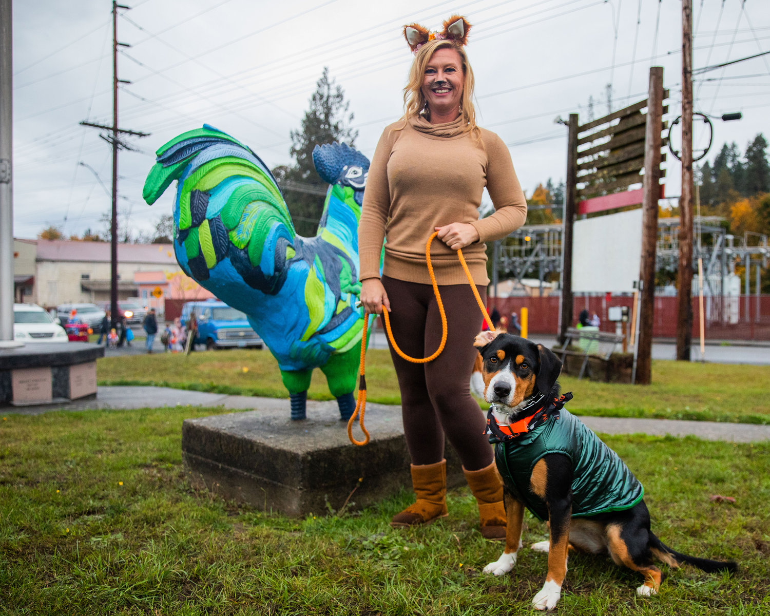Robin Brumley, owner of the Winlock Dance Center, smiles for a photo with her dog Charlie during Egg-O-Lantern festivities on Halloween.