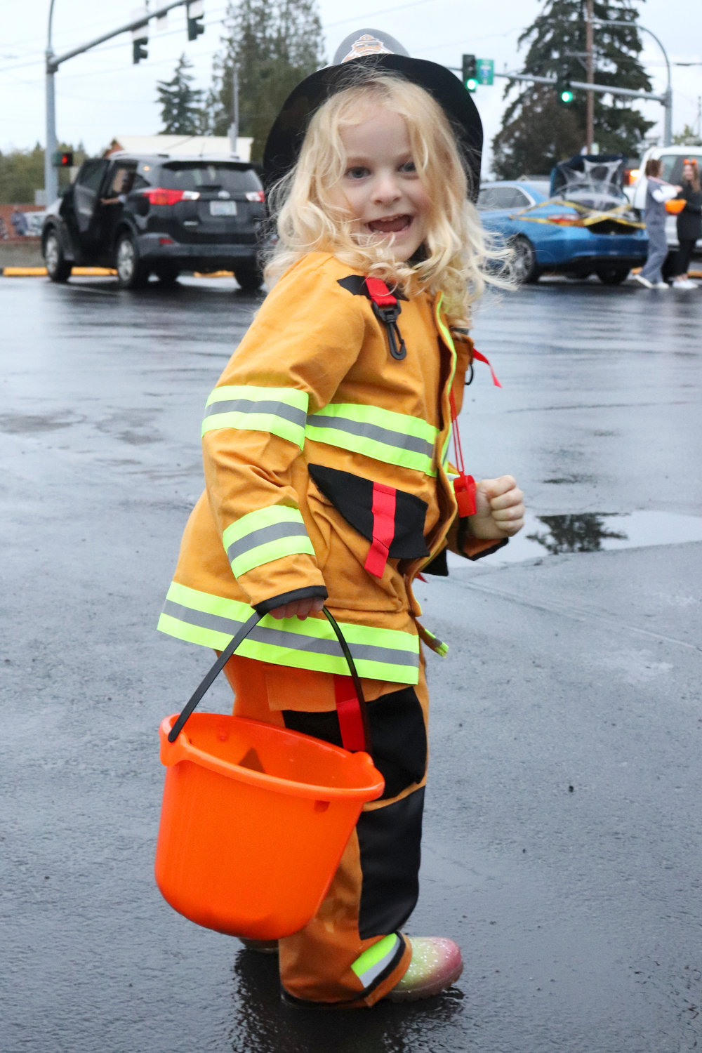 Ivy, 3, shows off her firefighter costume outside of the Lewis County Fire District 5 station in Napavine during a trunk or treat event on Monday.