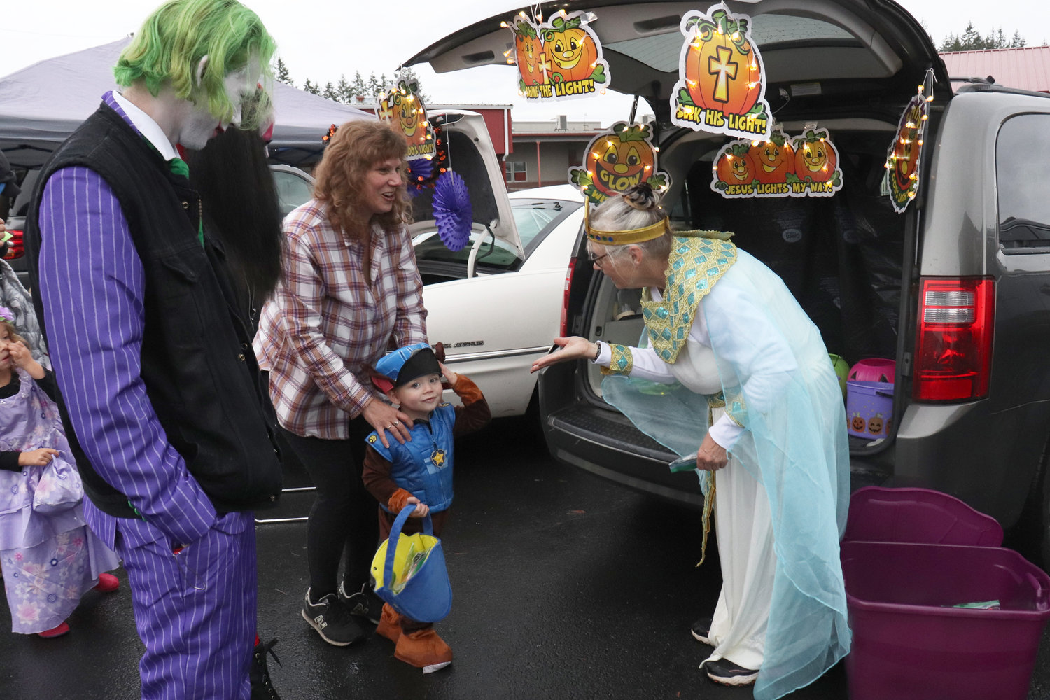 A trunk or treat participant blows a kiss to a trick-or-treater outside of the Napavine Assembly of God Church on Monday.