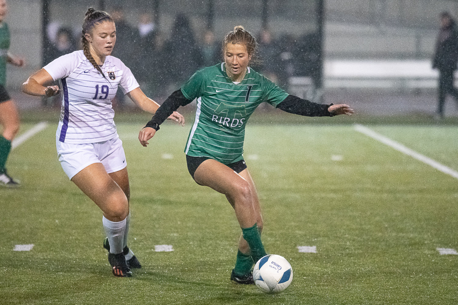 Tumwater forward Emalyn Shaffer dribbles around a Columbia River defender Nov. 3 in the 2A District 4 championship game.