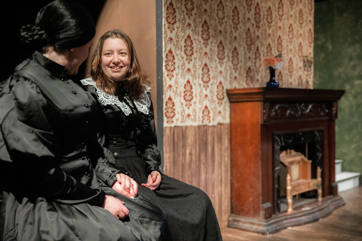 Beka Lashley playing “Wilson,” and Alyssa Graves playing “Elizabeth Barrett,” smile on stage during dress rehearsals for “Leaving 50 Wimpole Street” inside the Phillip Wickstrom Studio Theatre at Centralia College on Thursday.