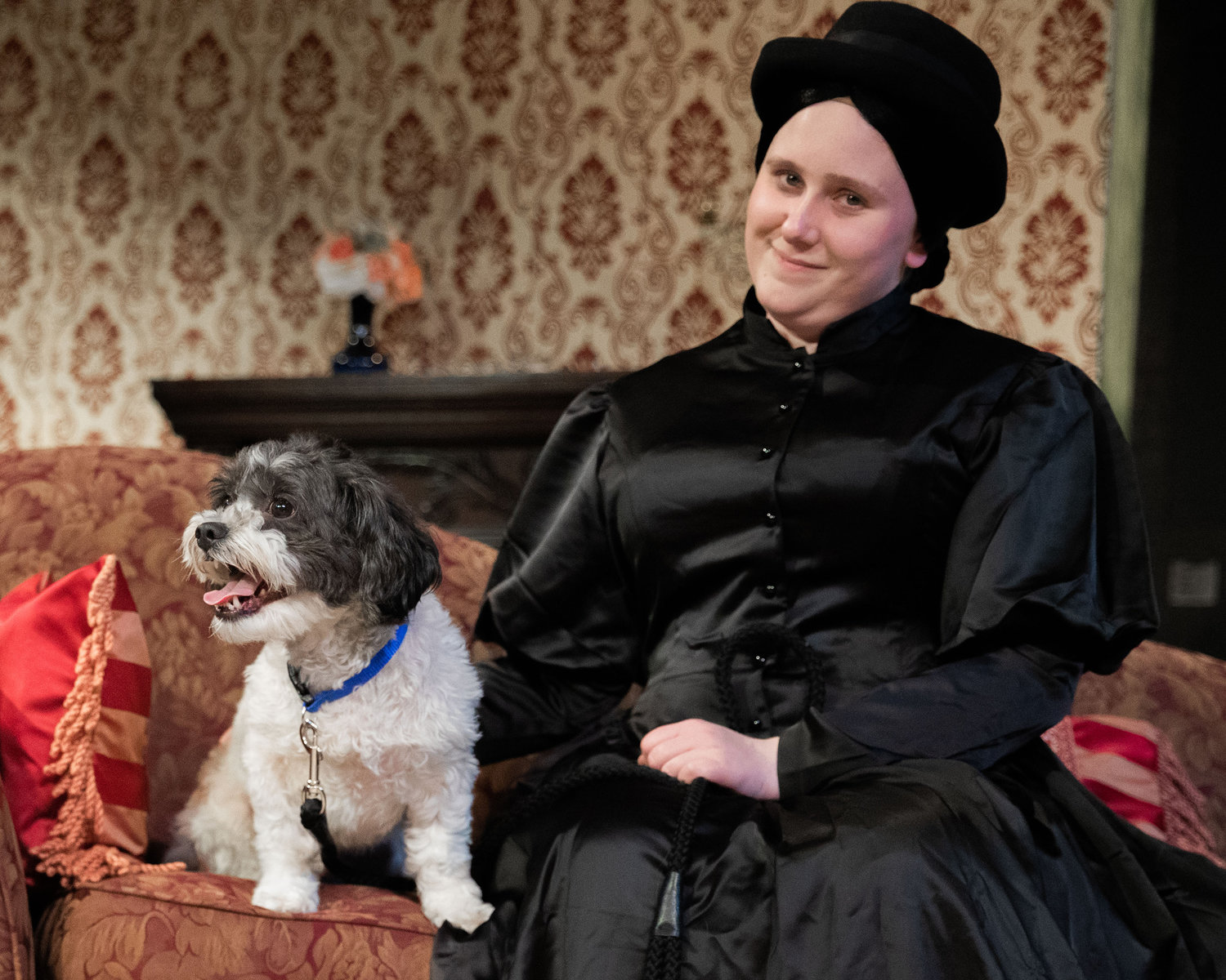 Beka Lashley playing “Wilson,” smiles for a photo alongside a dog named Ozzy playing “Flush,” during dress rehearsals for “Leaving 50 Wimpole Street,” inside the Phillip Wickstrom Studio Theatre at Centralia College on Thursday.