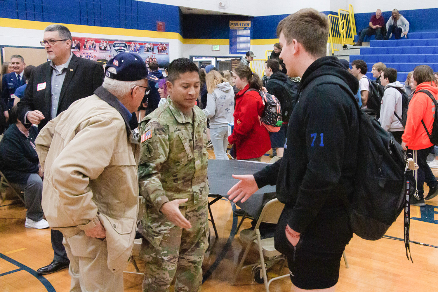 Following his speech at Adna High School's Veterans Day Assembly, Army Master Sergeant and Green Beret Jonathan Lu greeted students before they headed to class.
