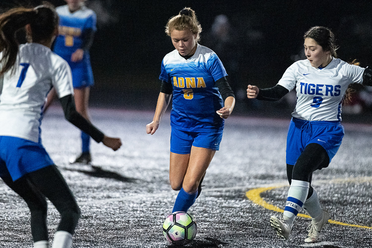Adna's Alainna Roller dribbles through defenders against Tonasket in the first round of the state playoffs at Tenino Beaver Stadium Nov. 9.