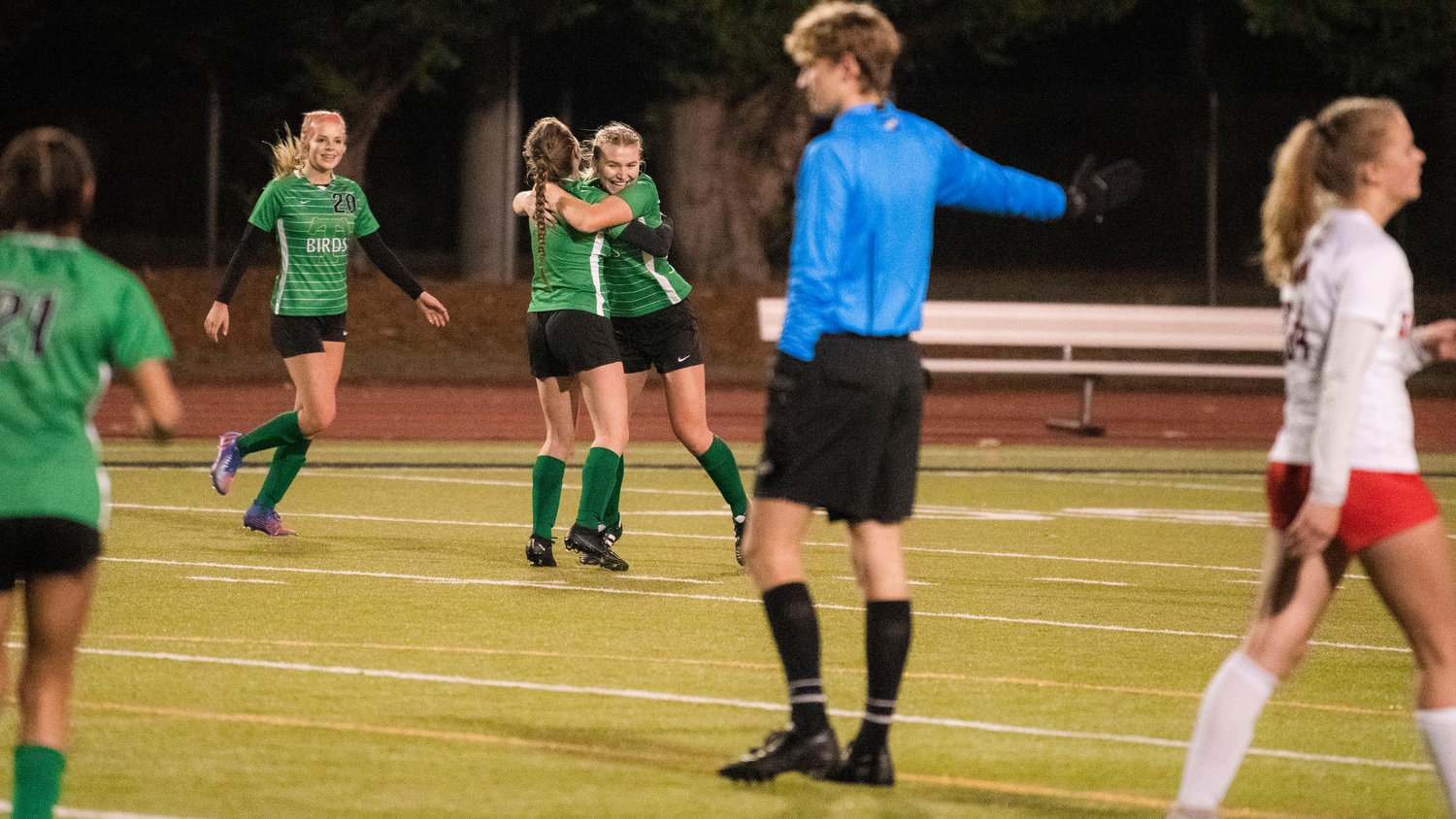 Tumwater senior Cierra Larson (6) celebrates a goal with teammates Wednesday night during a game against the Sammamish Redhawks.