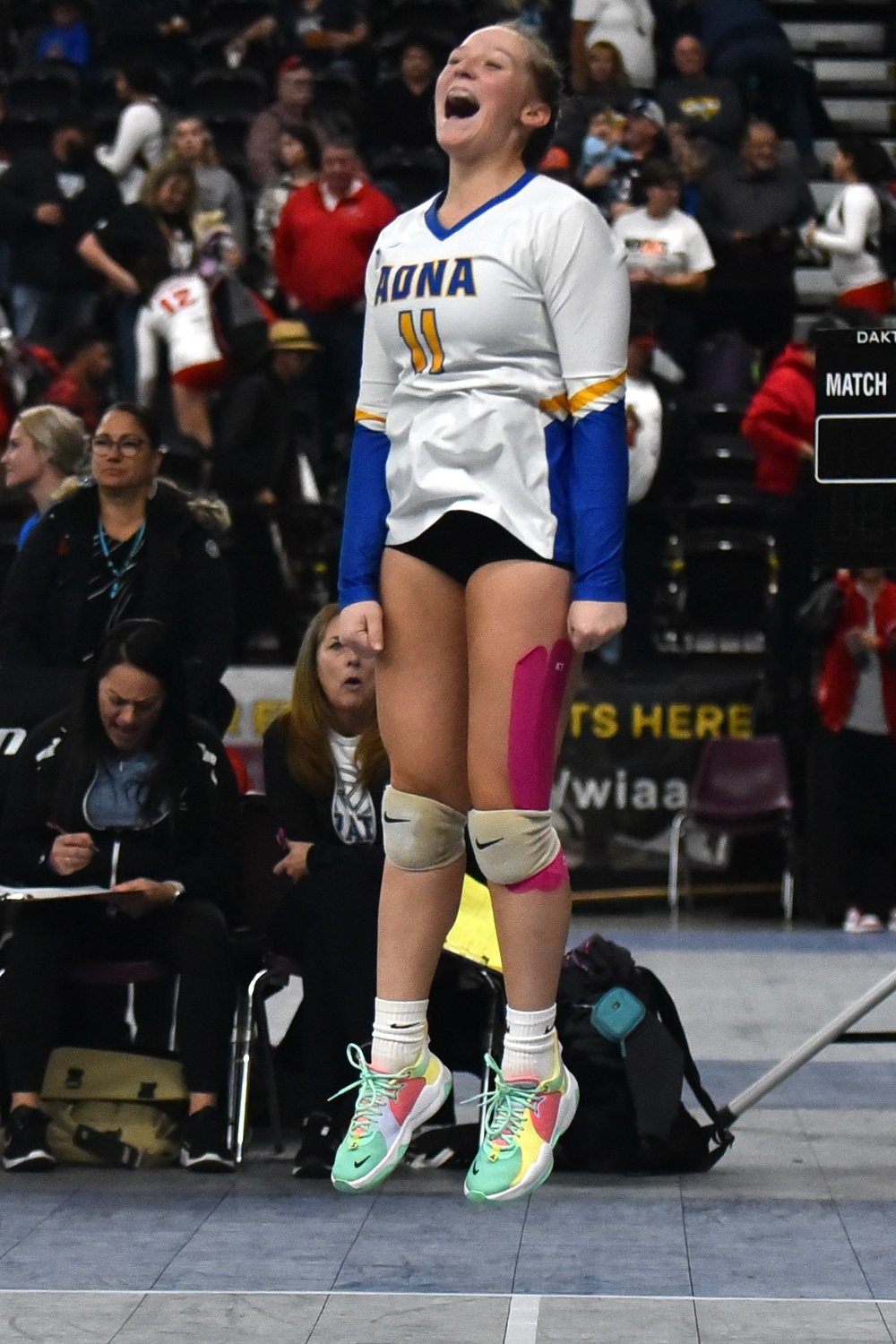 Adna's Kendall Humphrey levitates in celebration of a point during the third set of the Pirates' three-set win over No. 12 Tri-Cities Prep in the first round of the 2B state volleyball tournament on Nov. 10, at the Yakima Valley SunDome.