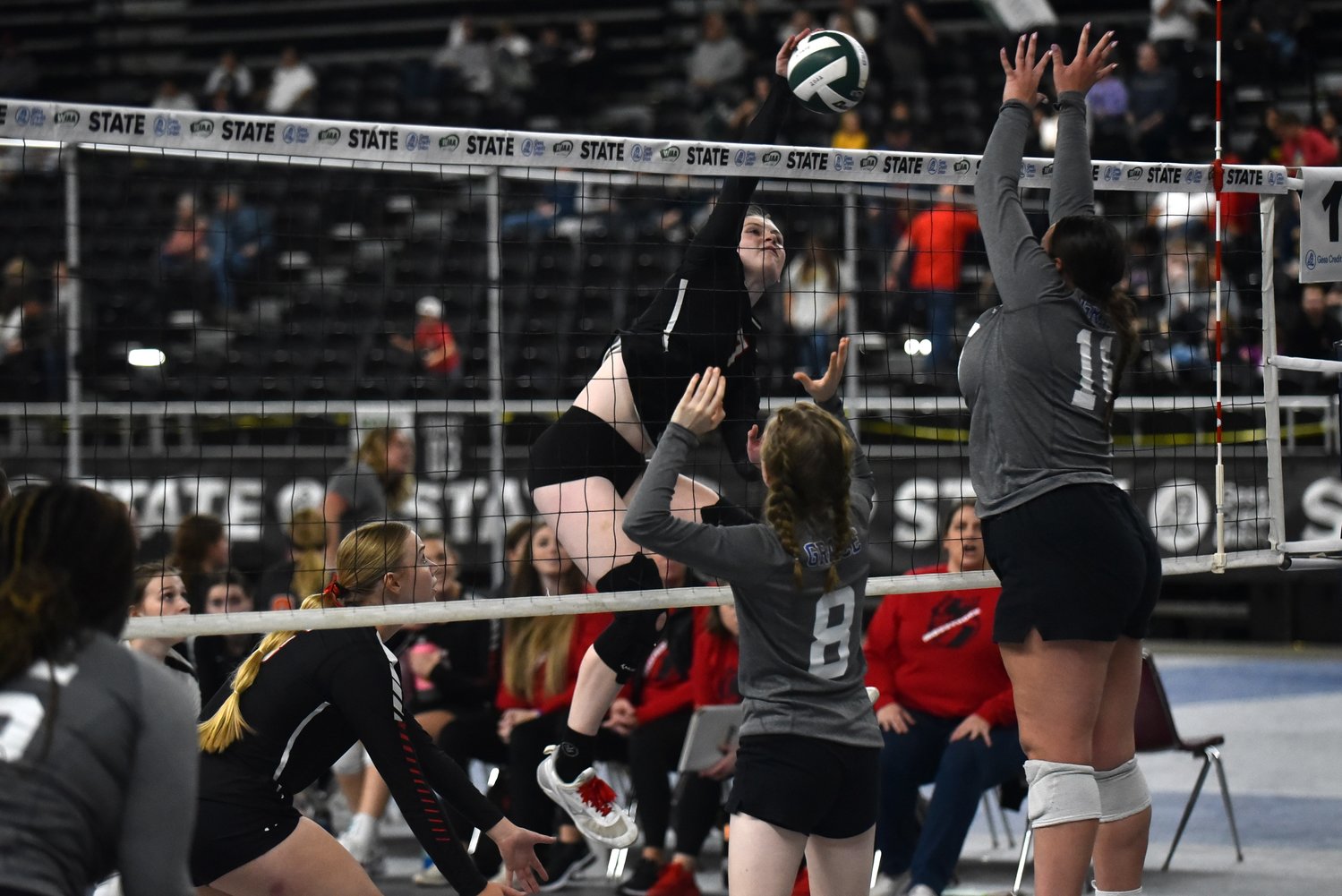 Paige Houghtelling puts down a spike against Grace Academy in Mossyrock's opening-round sweep at the 1B state tournament in Yakima on Nov. 10.