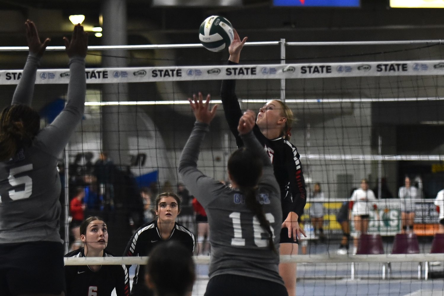 Hailey Brooks sends the ball over the net during Mossyrock's opening-round sweep of Grace Academy at the 1B state tournament on Nov. 10 in Yakima.