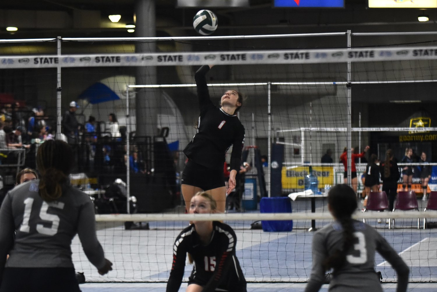 Payton Torrey goes up from the back row for a spike during Mossyrock's sweep of Grace Academy to open its run at the 1B state tournament in Yakima on Nov. 10.