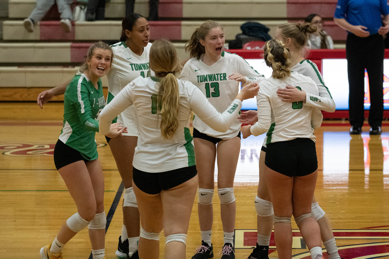 The Tumwater volleyball team celebrates after beating Hockinson in the first round of the 2A District 4 tournament at Myklebust Gym in Lower Columbia Community College Nov. 10.