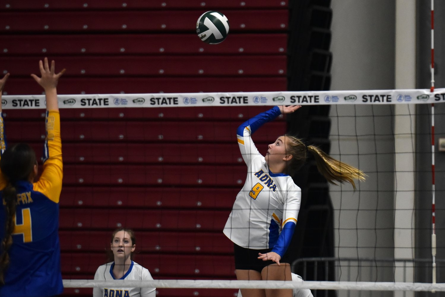 Danika Hallom goes up at the net during the first set of Adna's three-set loss to Colfax in the second round of the 2B state tournament on Nov. 10 in Yakima.