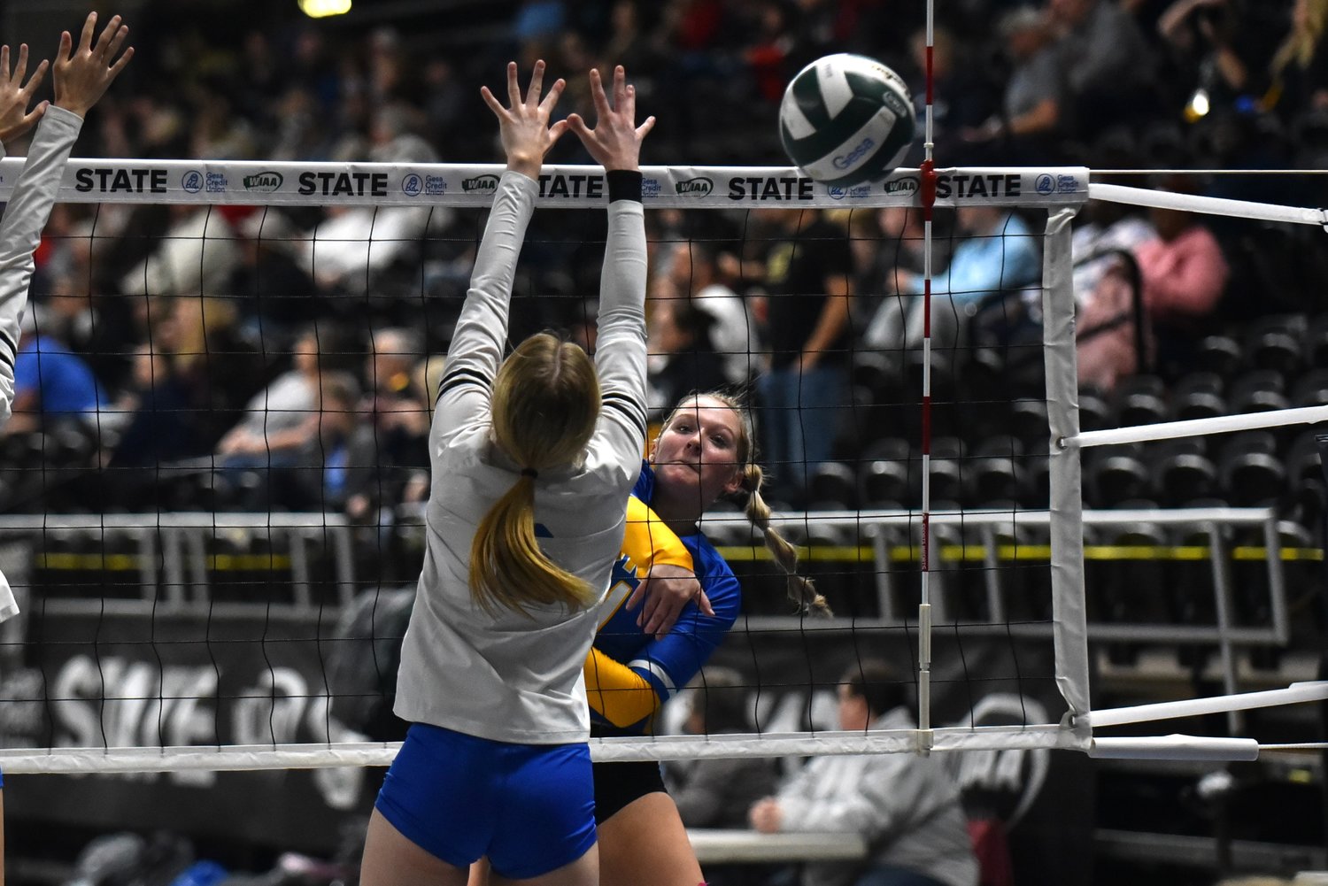 Kendall Humphrey gets a spike past the Toutle Lake block during Adna's four-set win over the Pirates at the 2B state tournament in Yakima on Nov. 11.