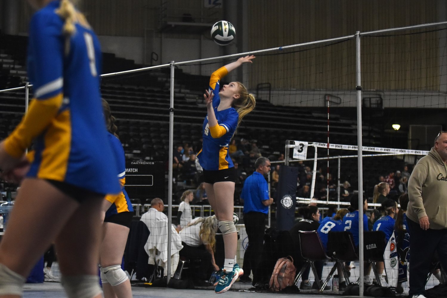 Gaby Guard serves the ball during the first set of Adna's four-set win in a loser-out match over Toutle Lake in the 2B state tournament in Yakima on Nov. 11.
