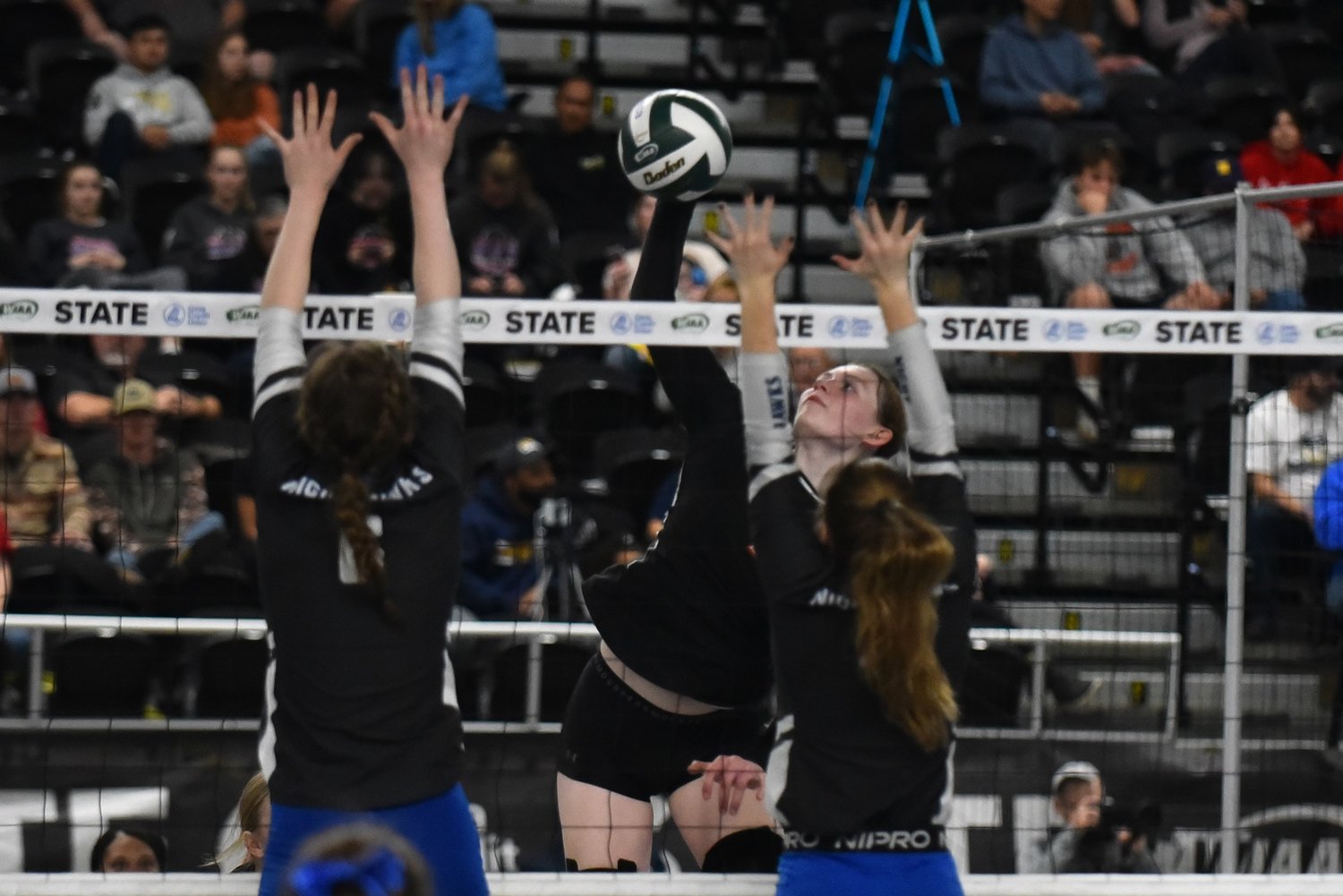 Paige Houghtelling goes up for a spike during Mossyrock's three-set loss to No. 1 Oakesdale in the 1B state title game, on Nov. 11 in Yakima.
