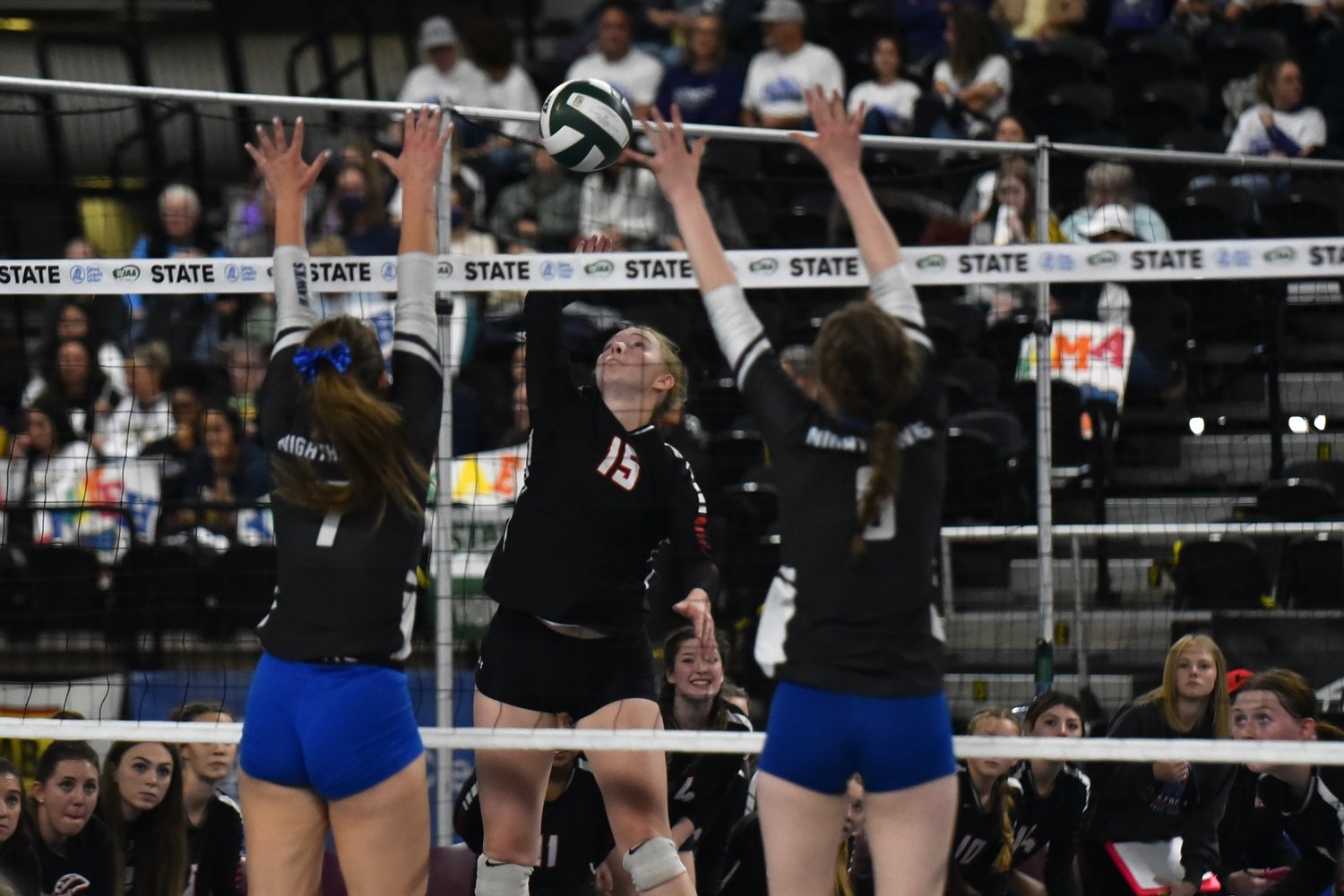 Hailey Brooks tries to split the Oakesdale block during Mossyrock's three-set loss to the Nighthawks in the 1B state title game, on Nov. 11 in Yakima.