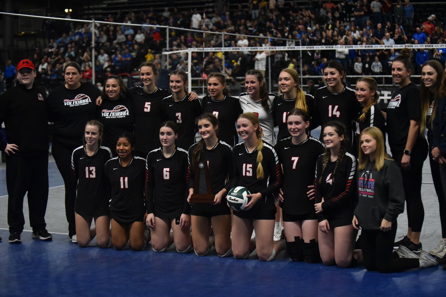 The Mossyrock volleyball team poses with its second-place trophy after its three-set loss to No. 1 Oakesdale in the 1B state title game, on Nov. 11 in Yakima.