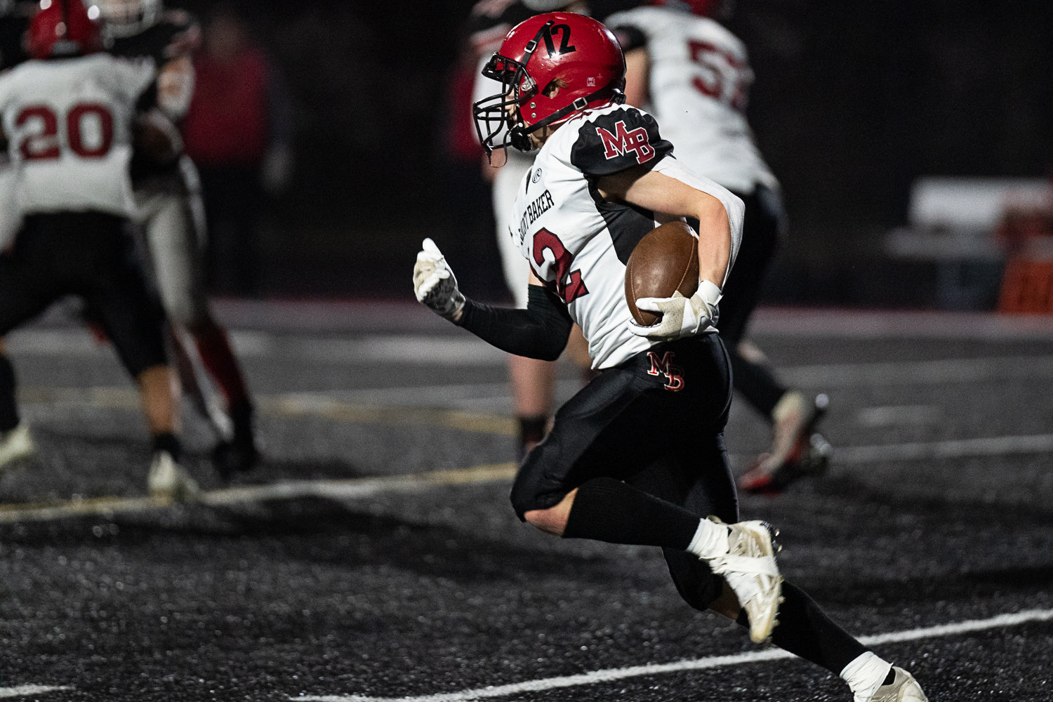 Mount Baker running back Landen Hanstead takes a handoff around the outside against Tenino Nov. 11 in the first round of the state playoffs.