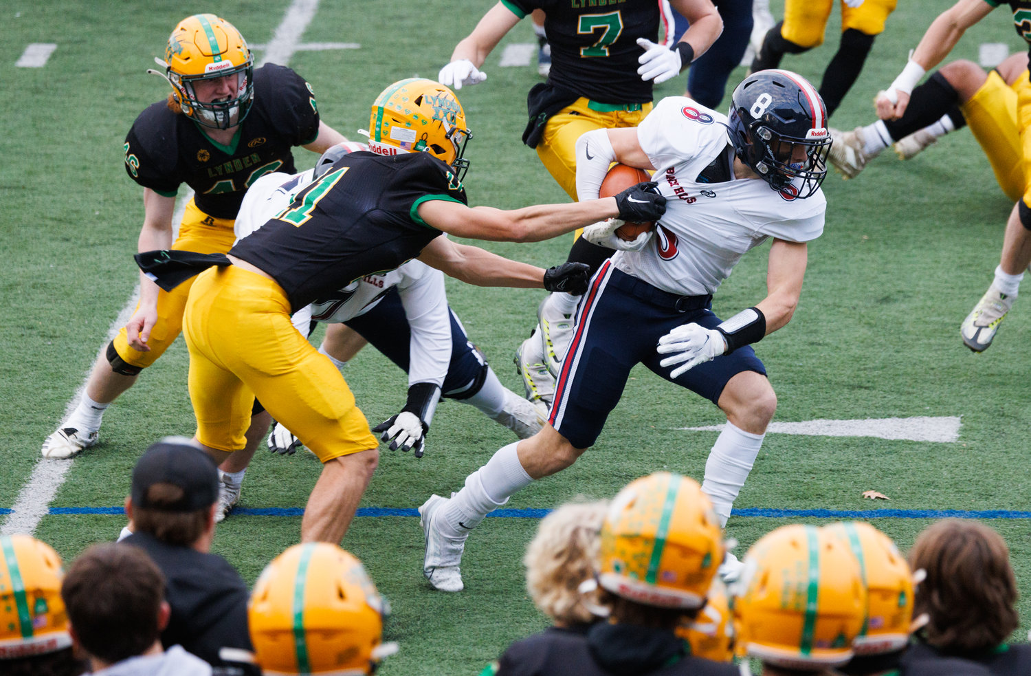 Black Hills’ Braiden Bond tries to get out from the grip of a Lynden defender as Lynden beat Black Hills 54-7 on Friday in Bellingham.