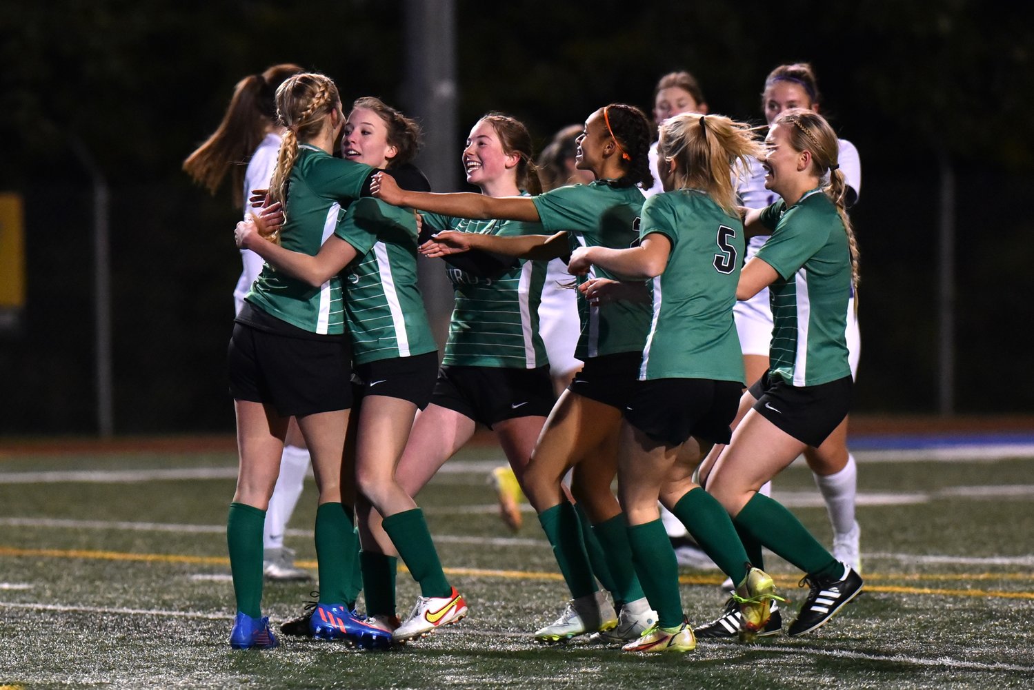 Tumwater players celebrate Kayla Pope's goal in the second half of the T-Birds' 3-1 loss to Columbia River in the 2A state semifinals, on Nov. 18 at Shoreline Stadium.