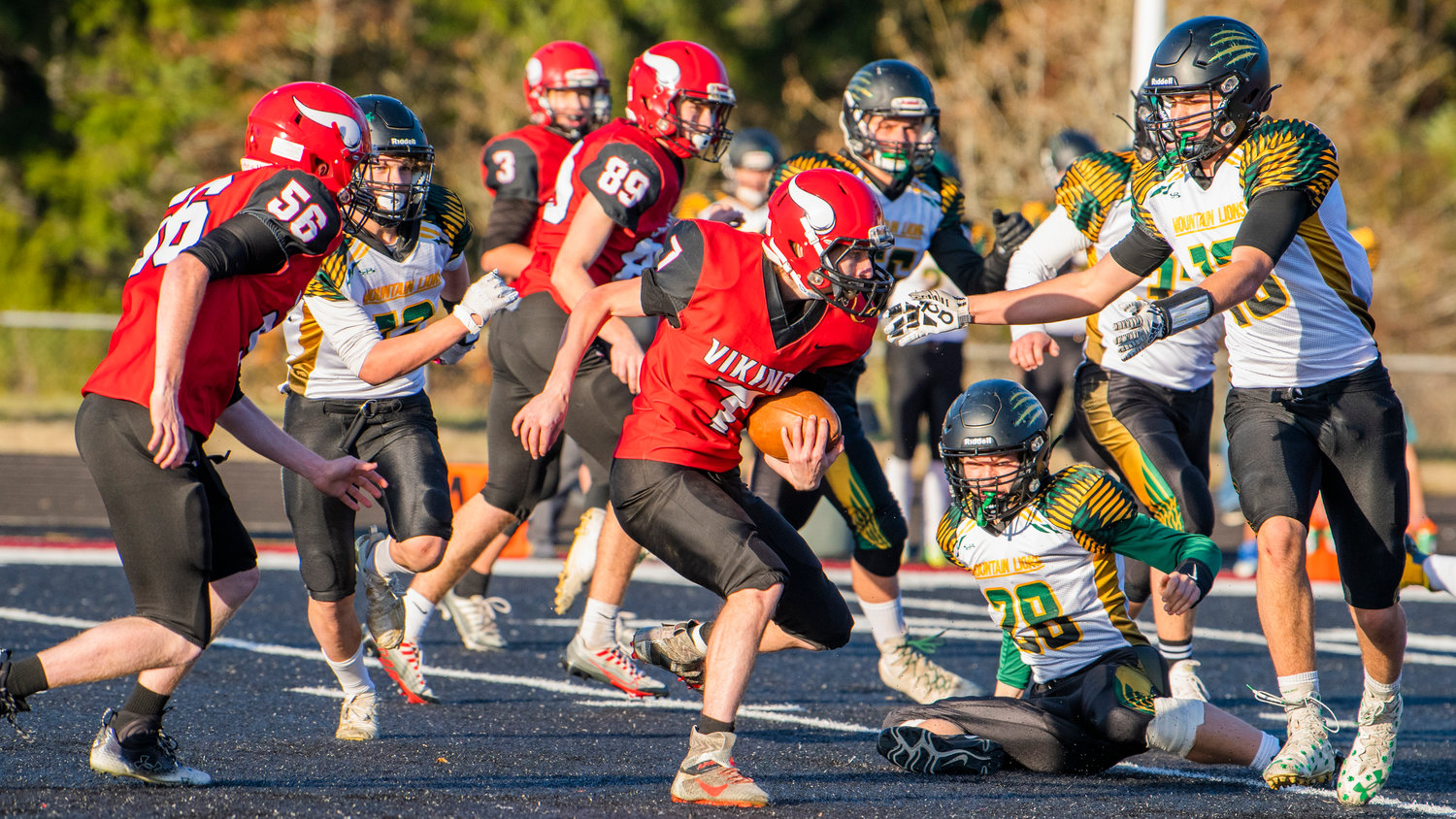 Mossyrock junior Peyton McClure (7) runs with the football during a Saturday afternoon game in Tenino.