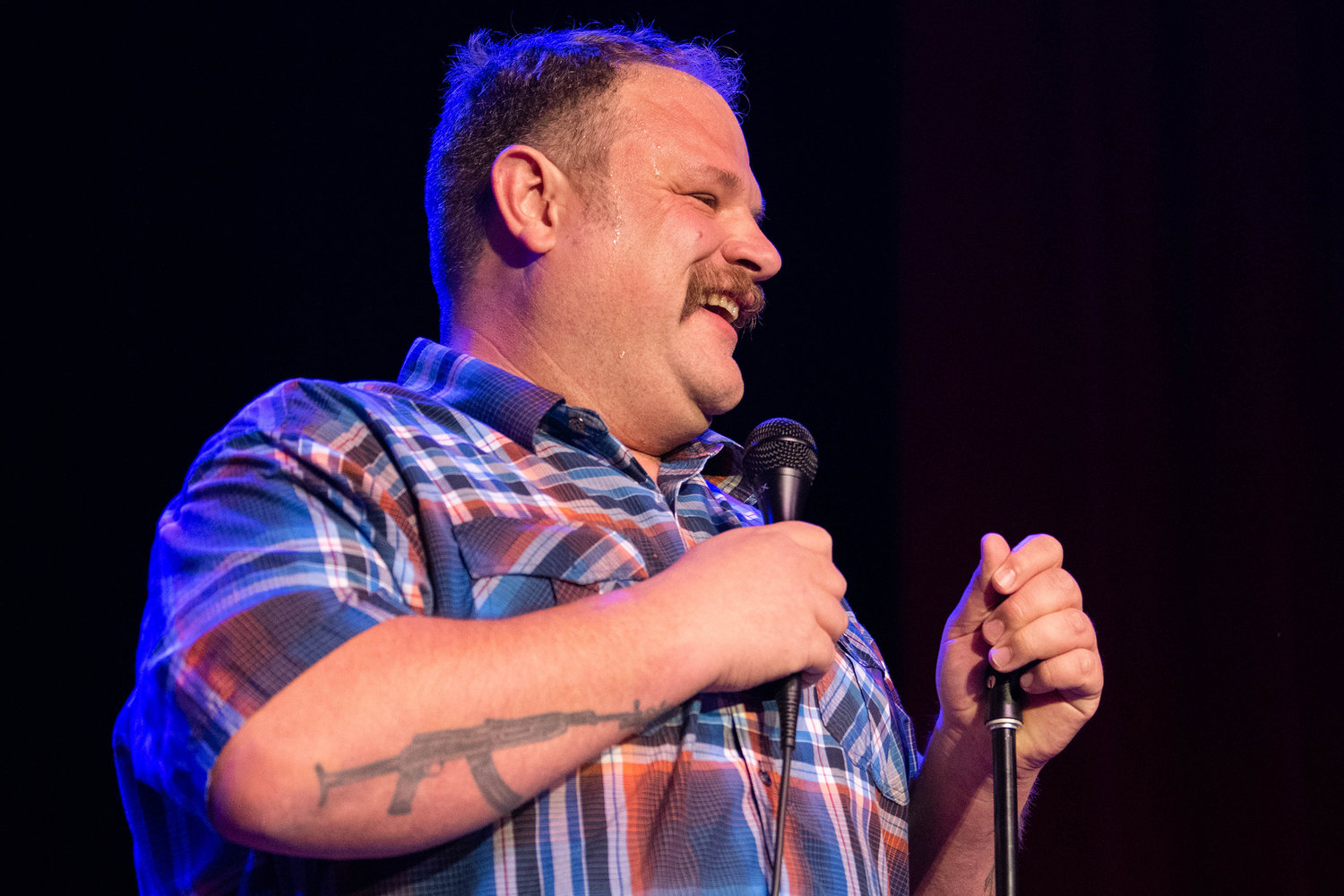 Local favorite Sam Miller laughs while telling jokes Friday night at the McFiler’s Chehalis Theater during a sold out comedy show.
