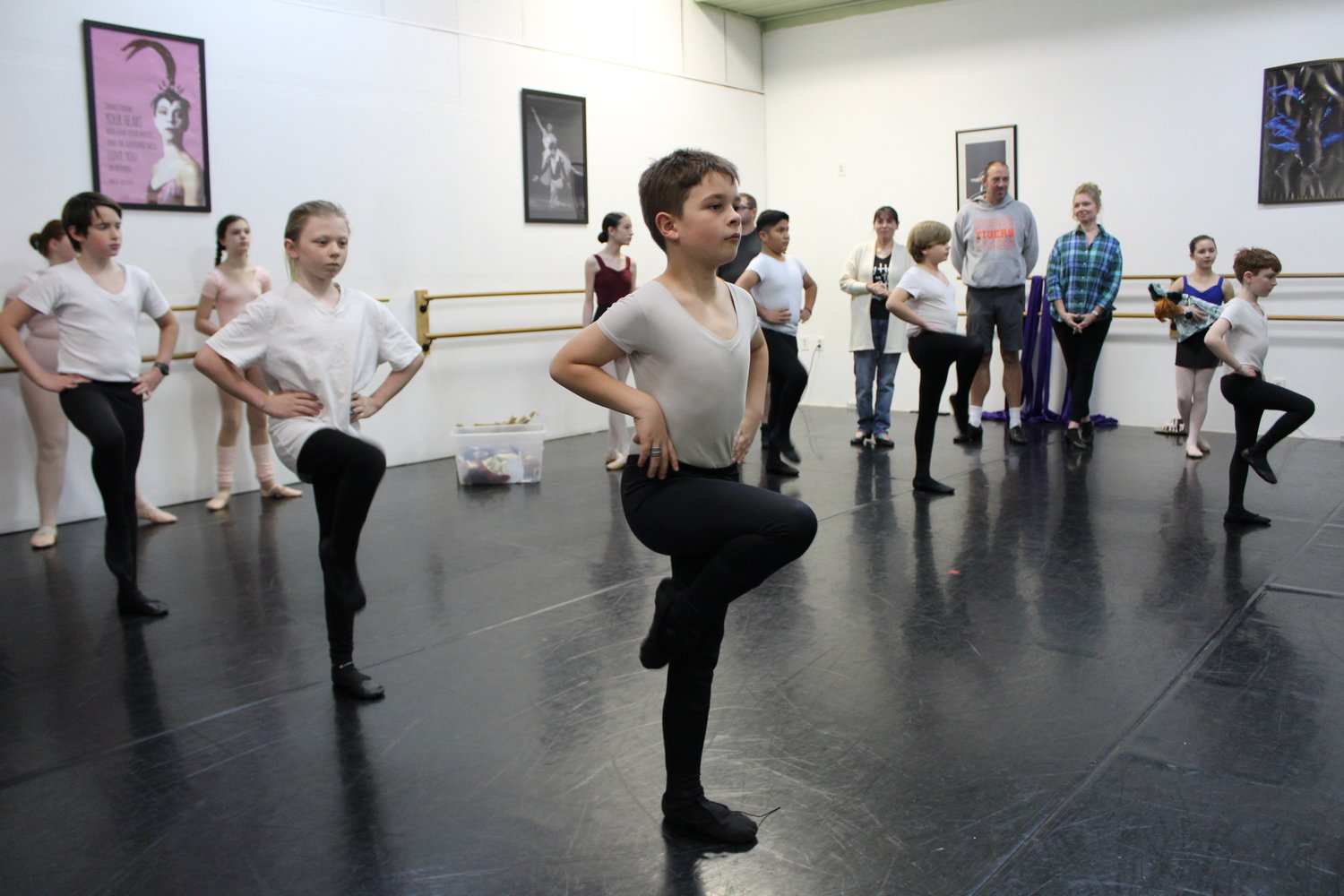 Dancers portraying party boys rehearse for their upcoming roles in "The Nutcracker" by Centralia Ballet Academy.