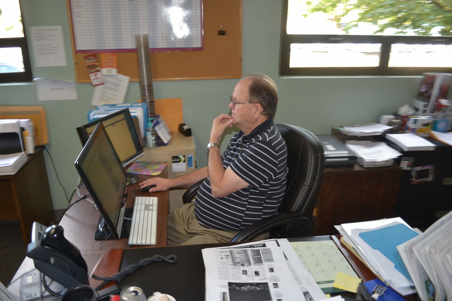 Lifelong Chronicle journalist Doug Blosser in his element, The Chronicle newsroom, in 2012. As newsroom clerk he produced a vast volume of words that appeared in the newspaper, from restaurant health inspections to court records and Voices items. Blosser died Nov. 16, 2022, at age 74.