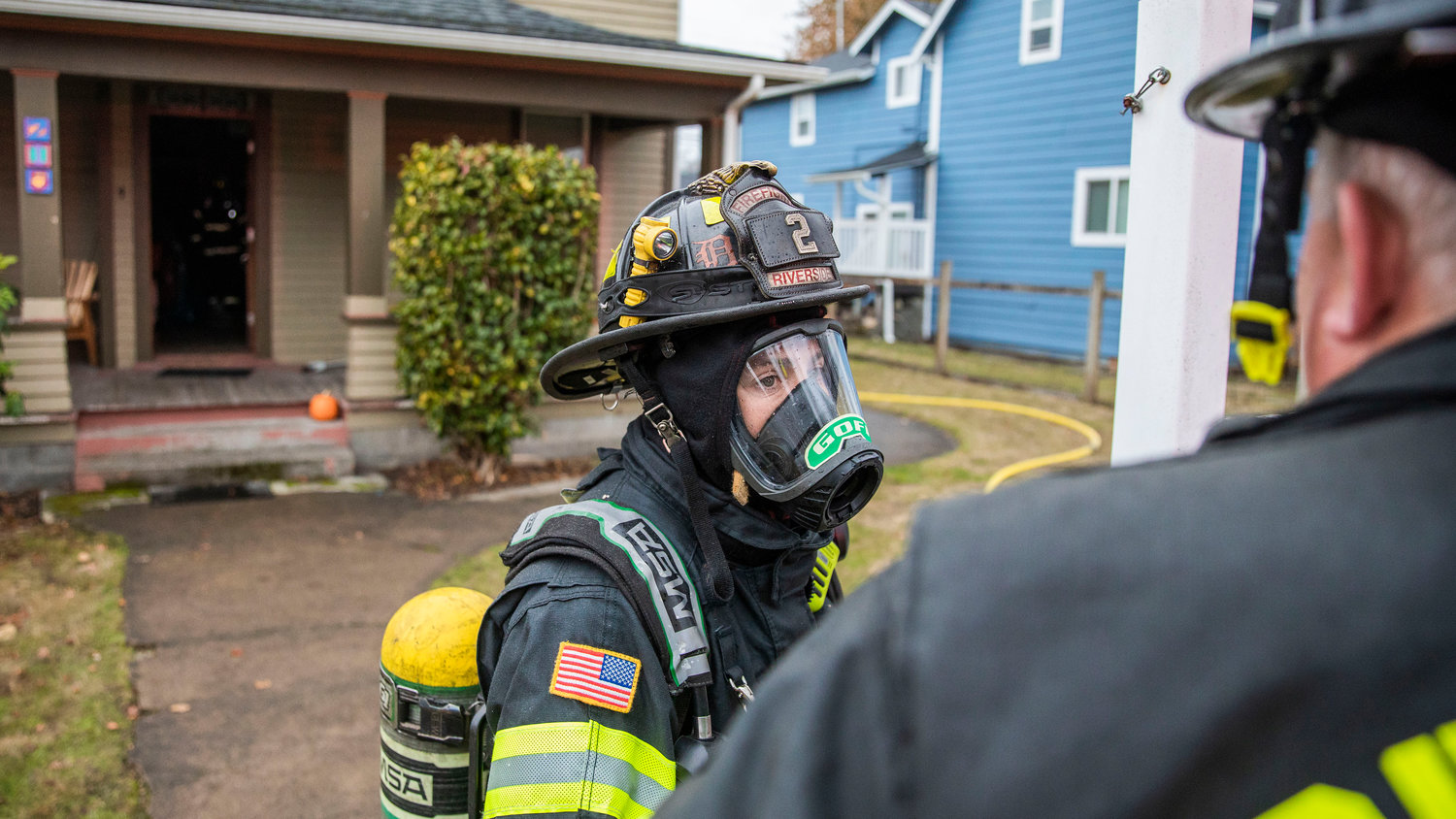 Riverside firefighters respond to a residential fire in the 200 block of North Rock Street in Centralia on Friday.