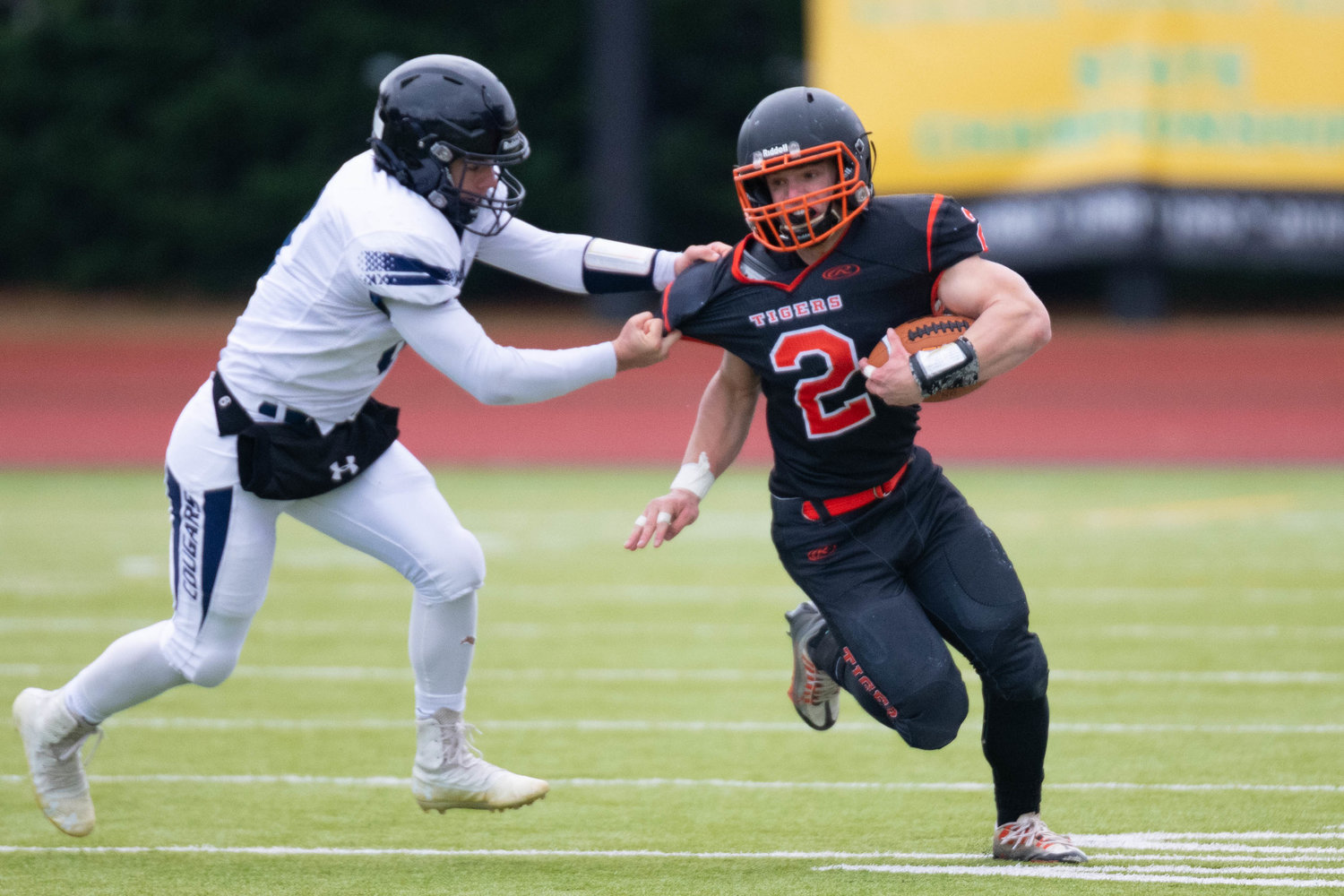 Napavine's Cael Stanley tries to break a tackle during the first quarter of the Tigers' 49-6 win over Chewelah at Tumwater District Stadium in the 2B semifinals on Nov. 26.