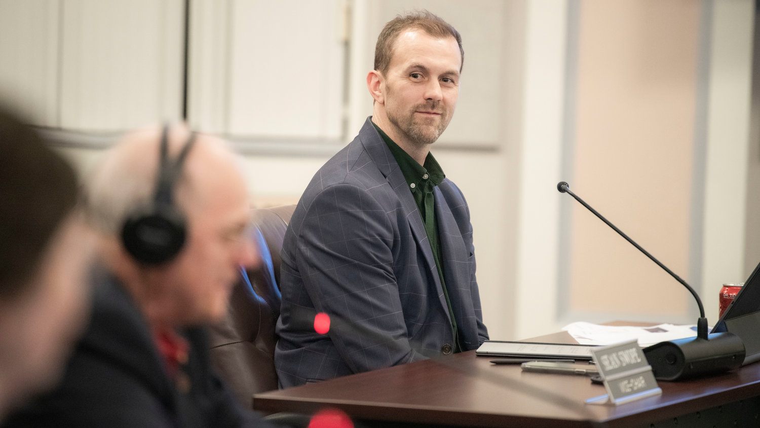 Commissioner Sean Swope smiles while attending a 2023 Preliminary Budget Review meeting on Tuesday at the Lewis County Courthouse in Chehalis.