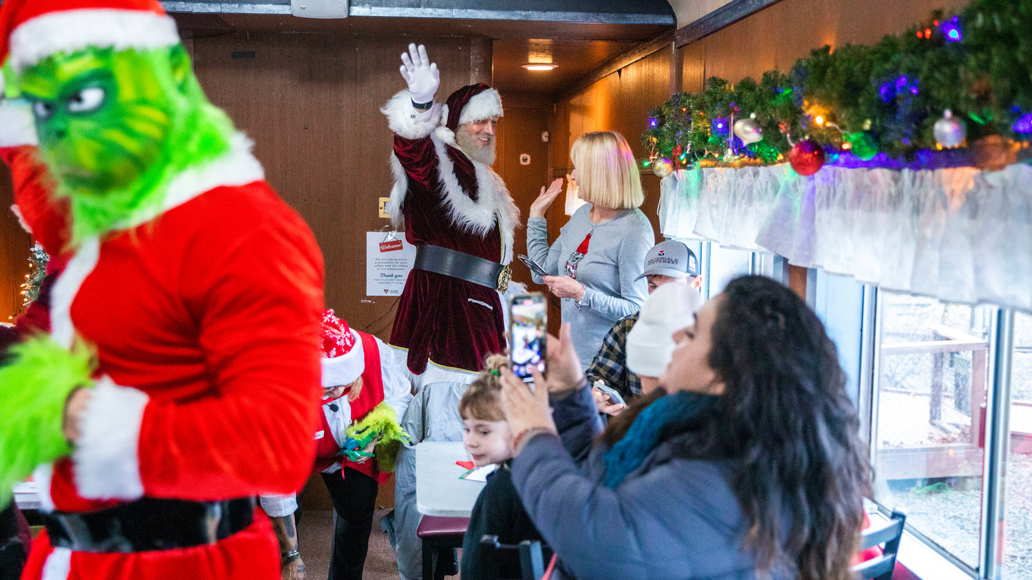 Santa waves to passengers at the Steam Train Depot in Chehalis on Saturday.