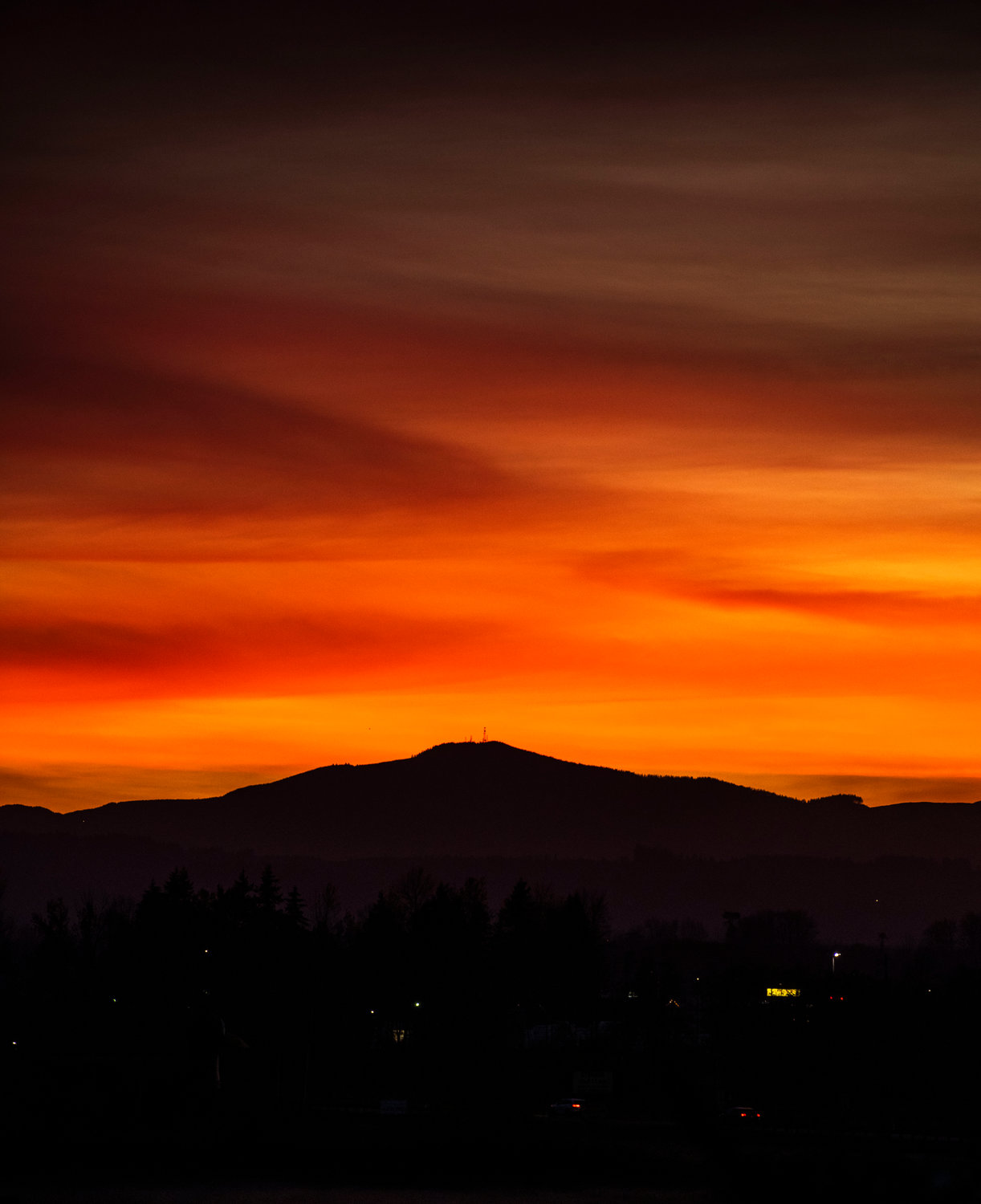 The sun sets over Baw Faw Peak and the Willapa Hills as seen from Chehalis Wednesday evening.