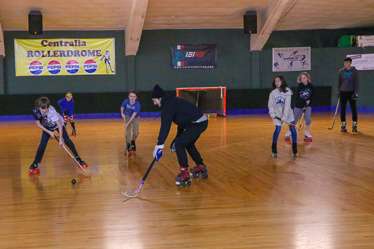 Members of the Centralia Sharks rollerhockey club participate in a scrimmage game at their weekly Saturday morning practice.