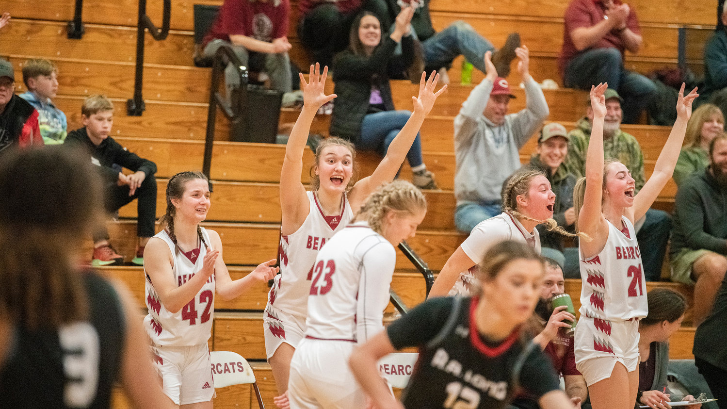 Bearcat athletes celebrate a score Tuesday night during a game against R.A. Long in Chehalis.