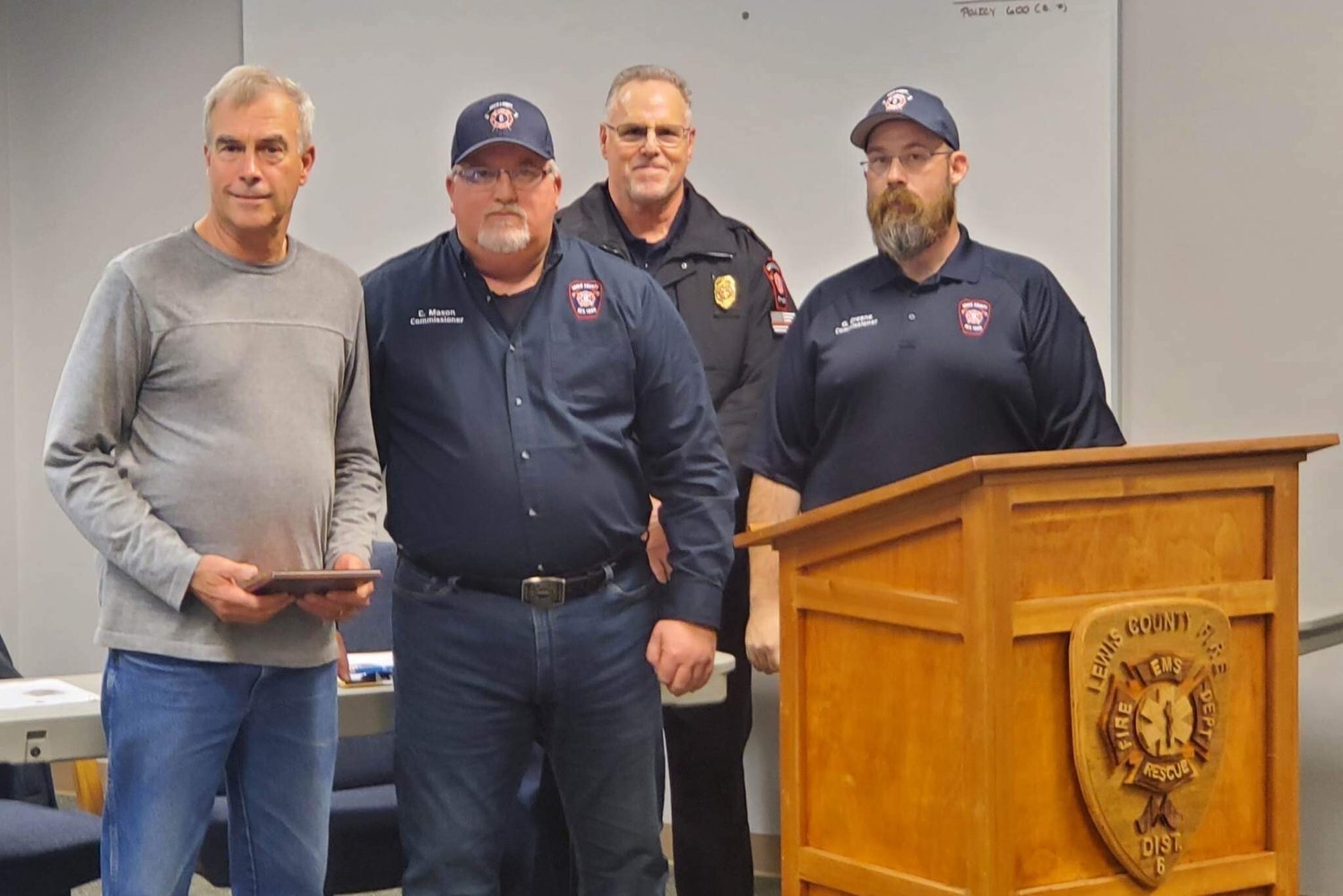 Board Chair Colin Mason presented a service award to Kevin Curfman, who retired as a volunteer firefighter with the district. Curfman retired from Chehalis Fire Department as a fire captain and volunteered with Lewis County Fire District 6. “While with Lewis County Fire District 6, Curfman was a dedicated volunteer who served the district and the community in many areas,” said the district. Curfman retired as a volunteer firefighter after 35 years of service. From left are Curfman, Board Chair Colin Mason, Fire Chief Ken Cardinale and Commissioner Greg Greene.