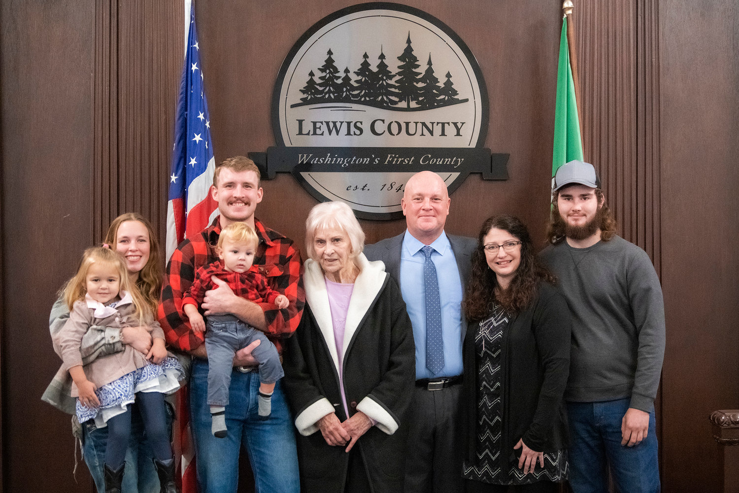 Scott Brummer smiles for a photo with family after being sworn in as the Lewis County District 3 commissioner Wednesday morning in Chehalis.