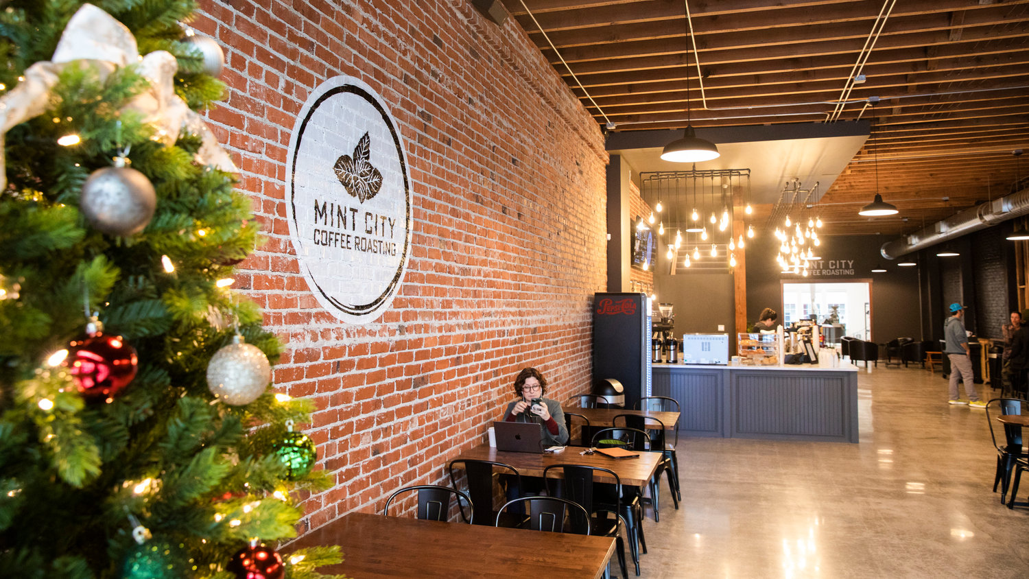 A Christmas tree sits on display at Mint City Coffee Roasting on opening day Tuesday morning in Chehalis.