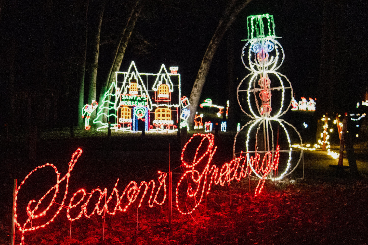 Lights illuminate characters and the words “Season’s Greetings” during a Christmas Lights Drive Thru at Borst Park in Centralia in 2022.