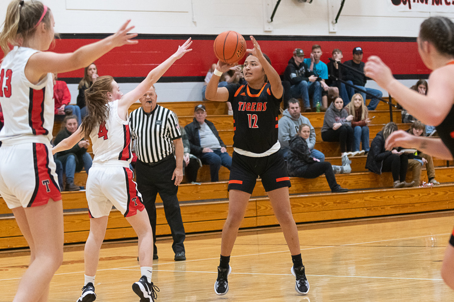 Centralia's Makayla Chavez pulls up from long range during the Tigers' 56-16 win over Tenino on Dec. 1.