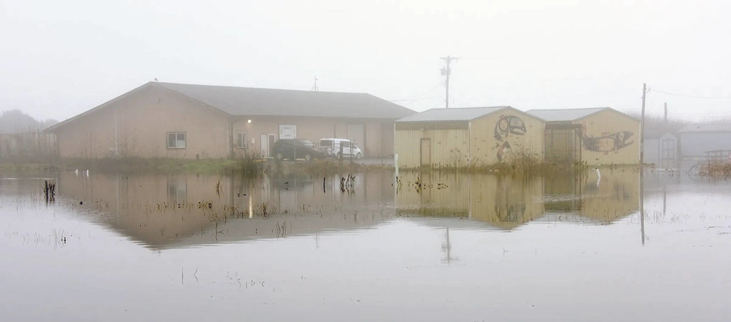 The Quinault have always lived at the mouth of the river that bears their name but climate change has turned winter surf, rains and river flows into a menace that floods their lower village, such as in this winter flood in January 2021.
