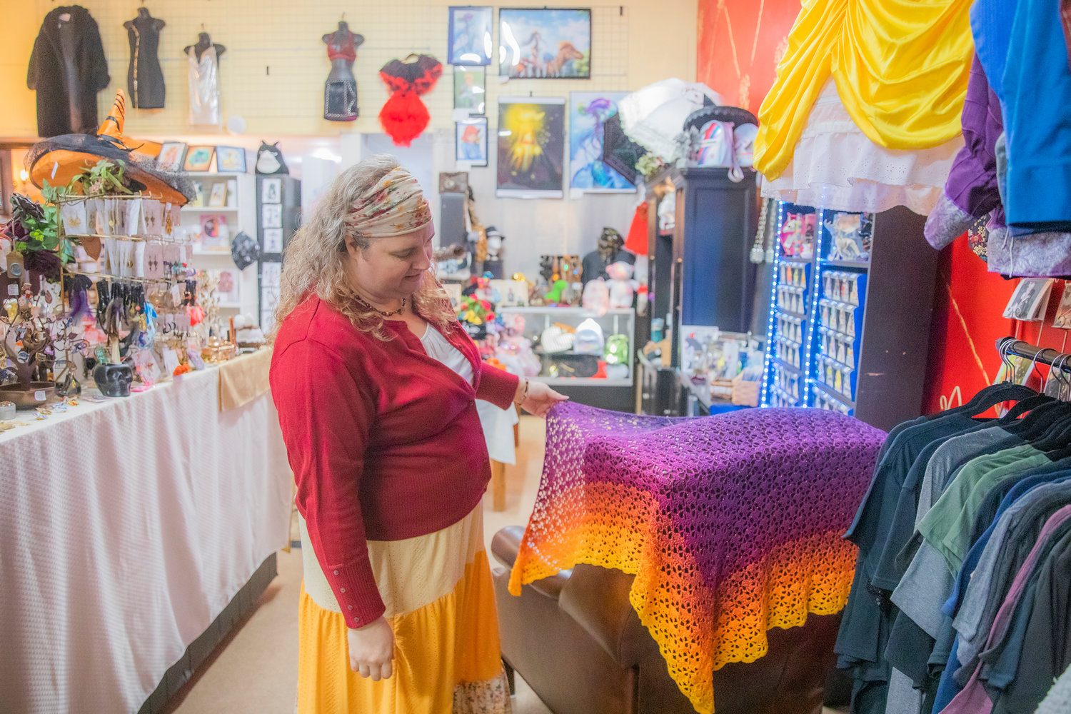 Christy Lakin displays handmade fabrics at The Victorian Showcase and Steampunk Emporium in downtown Centralia on Friday.