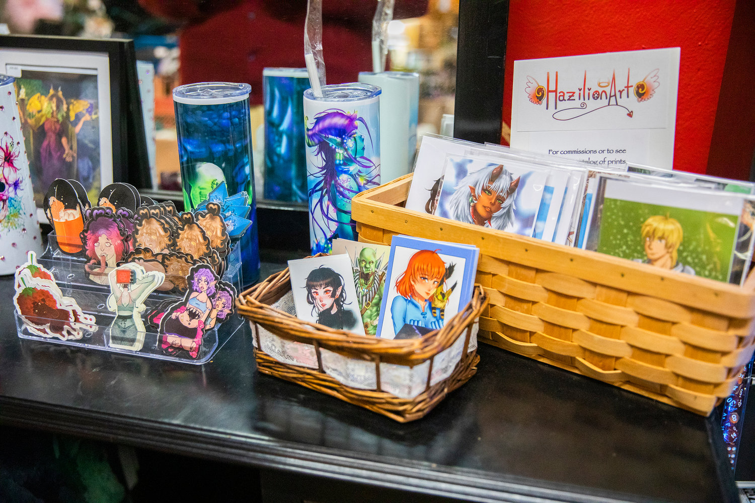 Stickers and and cards from young local artists are displayed at The Victorian Showcase and Steampunk Emporium in downtown Centralia on Friday.