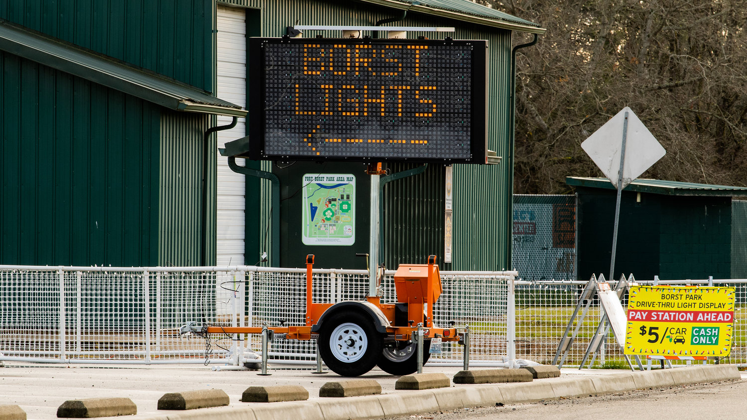 Signs point to the entrance of the Borst Lights display near Wheeler Field in Centralia on Friday.