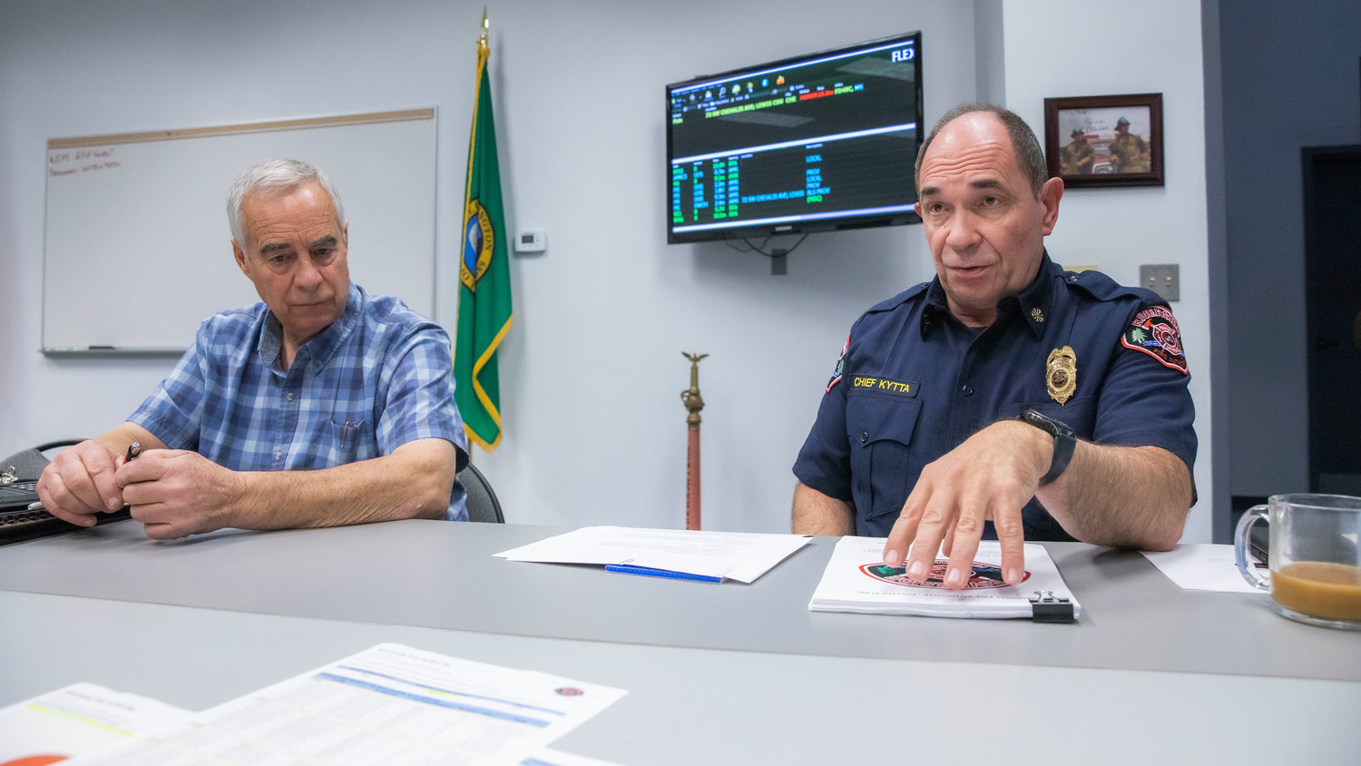 Gregg Peterson, chief at Lewis County Fire District 13 and Chief Mike Kytta, with Riverside Fire Authority, talk about the levy process and the effects of growth on their service in Centralia on Tuesday.