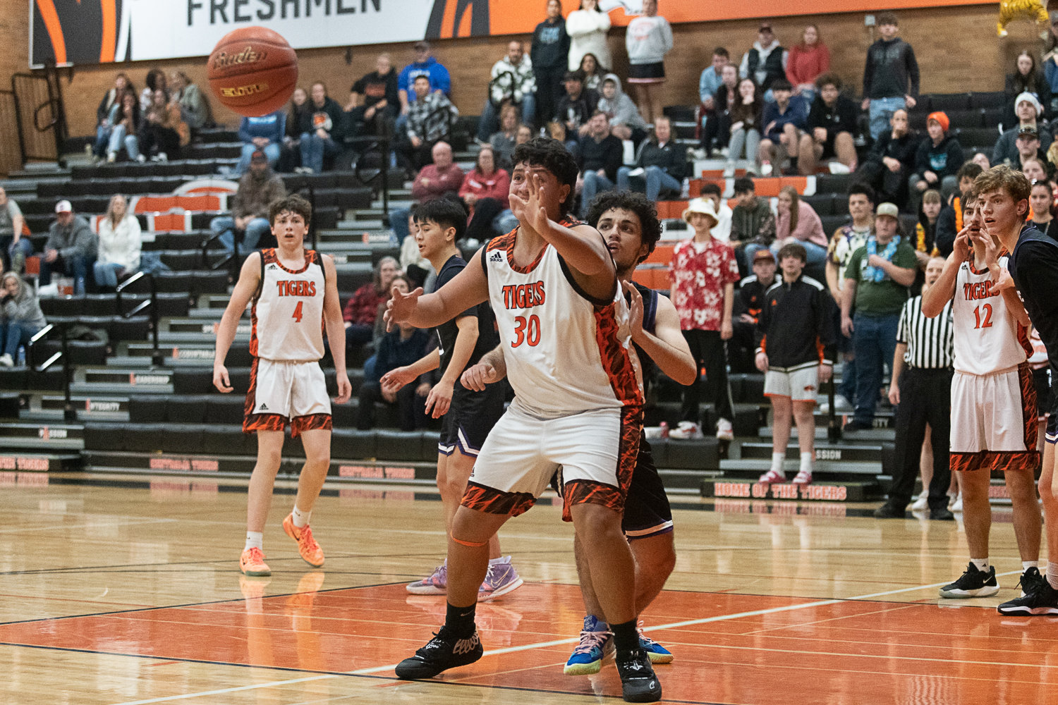 Carlos Vallejo receives the ball in the low post during Centralia's 56-34 loss to Heritage on Dec. 2. Vallejo led the Tigers with 16 points and 14 rebounds.
