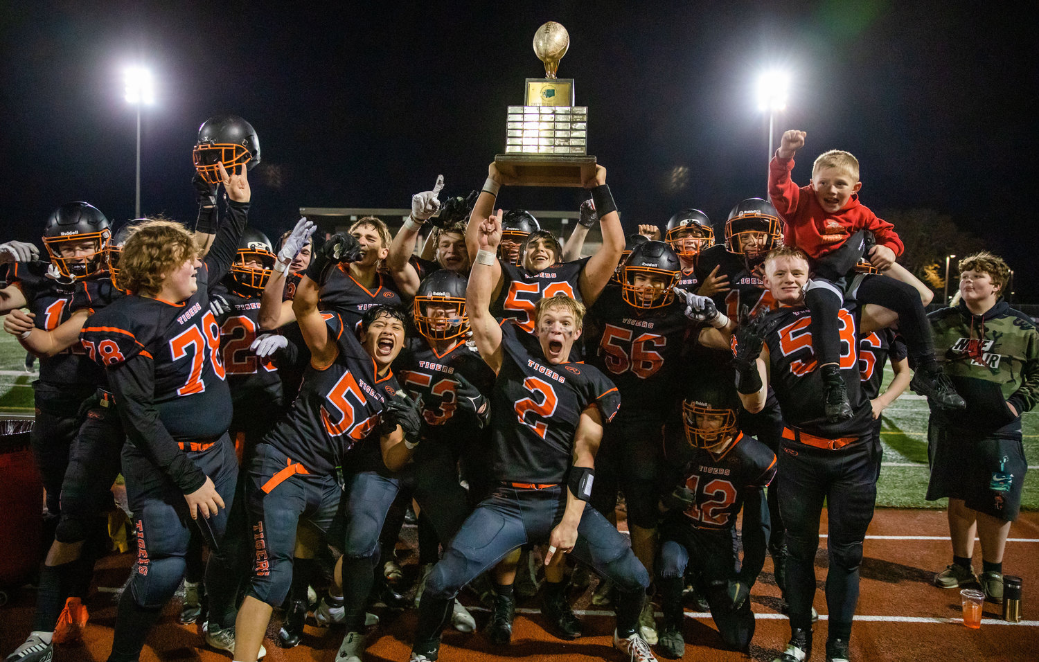 The Napavine High School football team celebrates winning the 2B State Championship Saturday night in Lakewood.