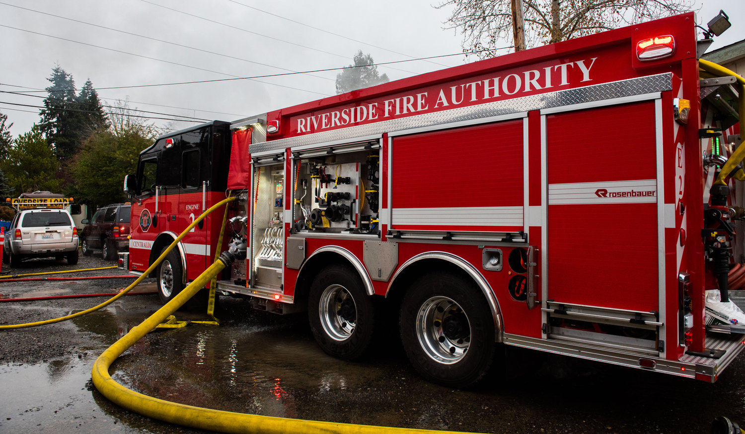 A Riverside fire engine responds to a residential structure fire off W. Main Street in Centralia on Sunday.